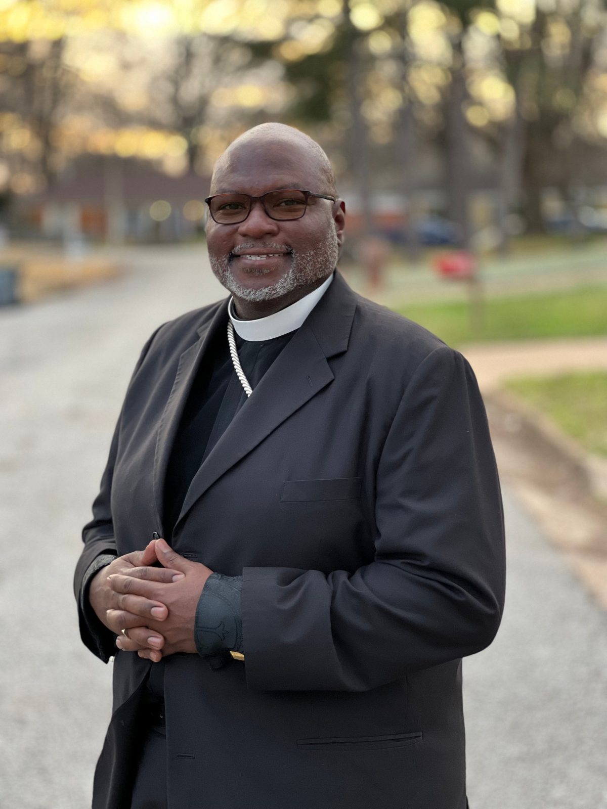 Church In Order consultant in clerical collar and dark suit