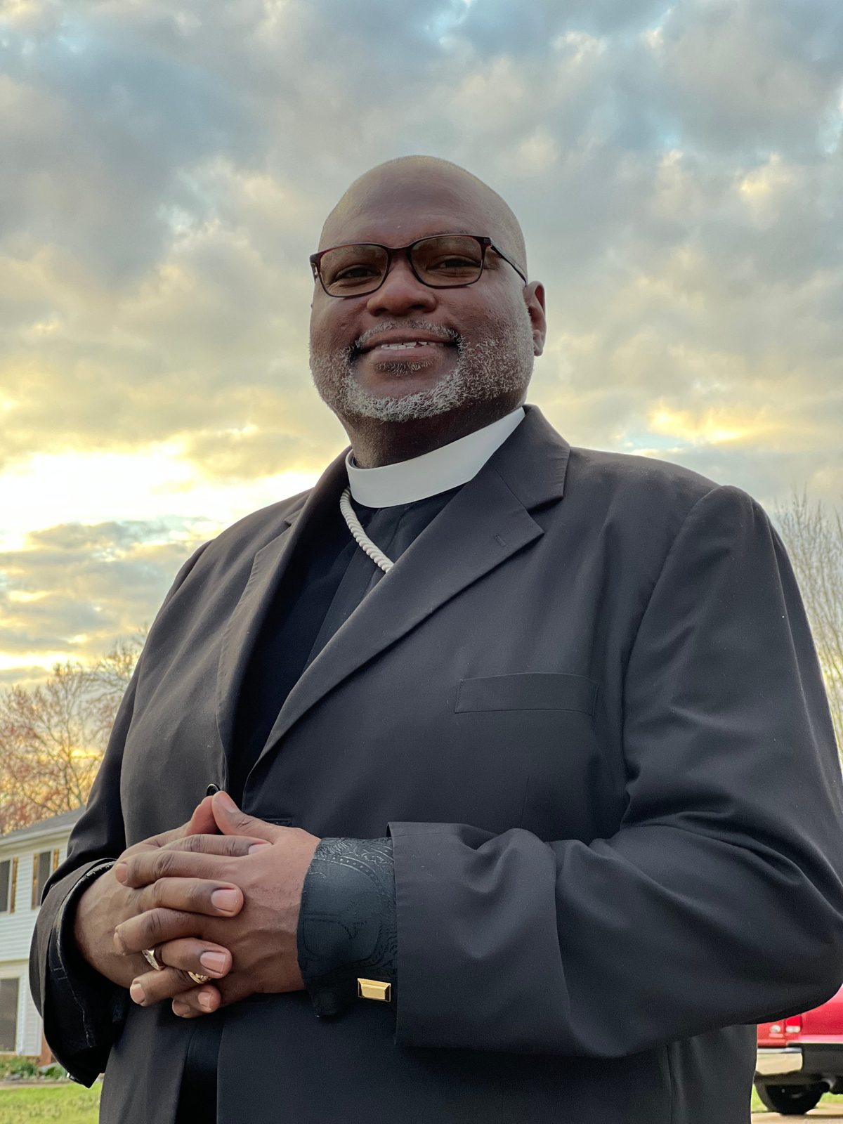 Church In Order consultant in clerical collar and dark suit